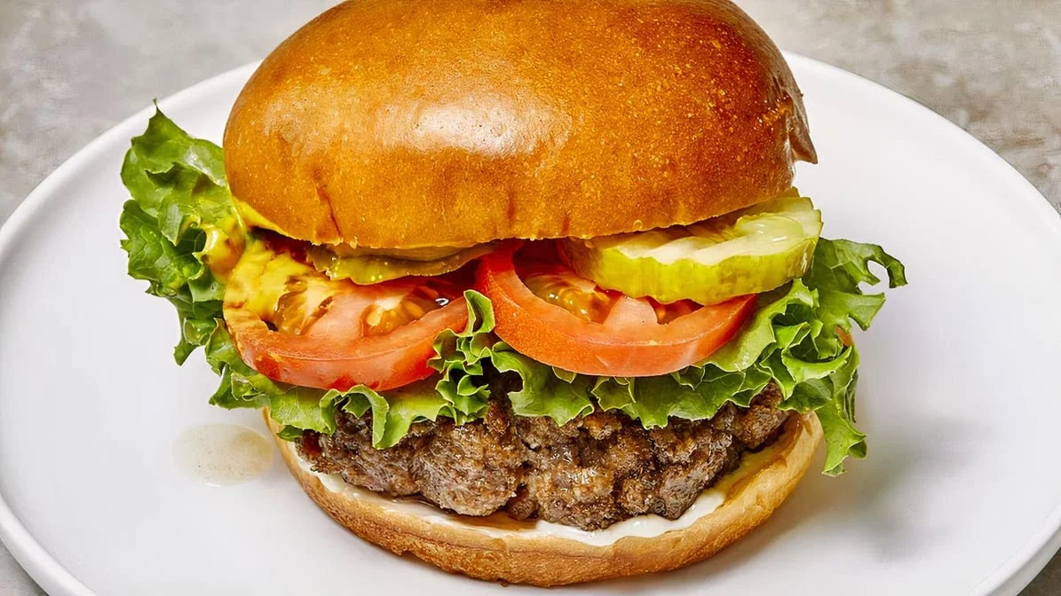 Signature 8oz London Burger — charbroiled beef patty on kaiser bun, London Ontario